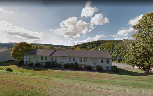 Three community association units surrounded by greenery